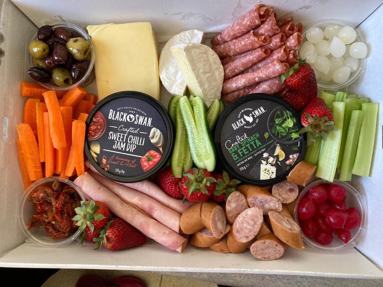 Charcuterie grazing box for adults — cheese, cured meats, fruit, and dips