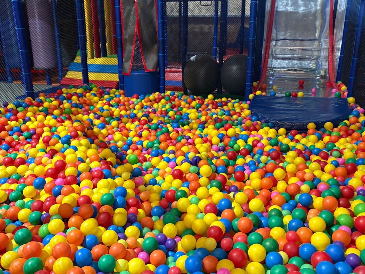 Close-up of the colourful balls inside the Rumble Tumbles ball pit