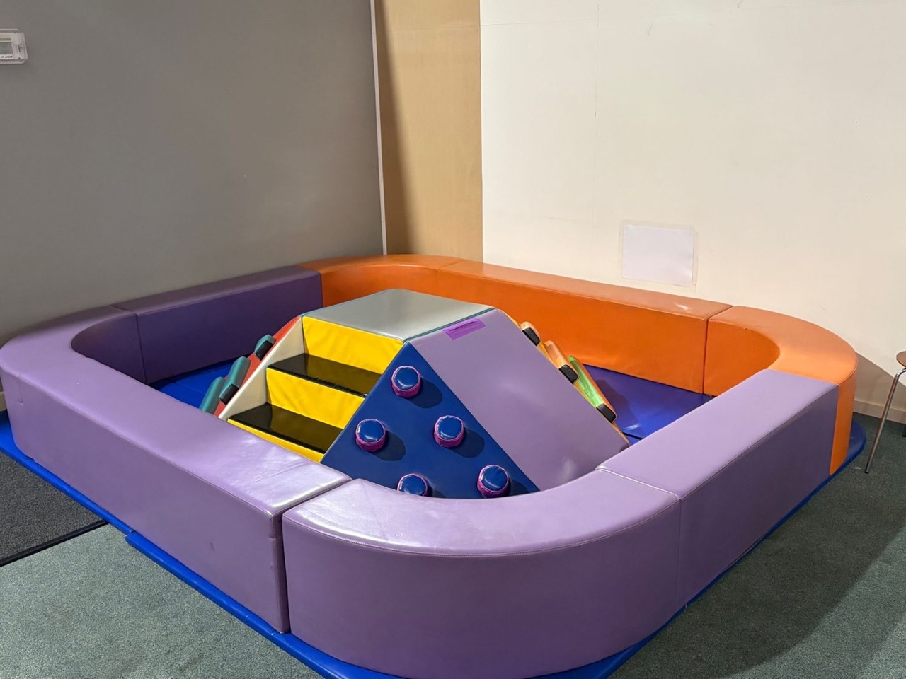 Soft purple and orange climbing area designed for toddlers